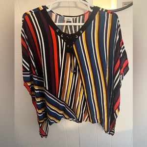 Multicolored blouse with gold rivets